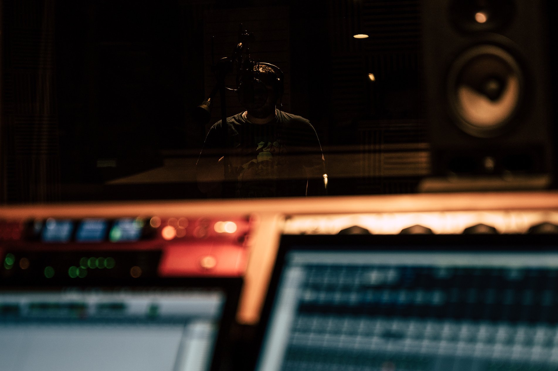 Man recording song in music studio